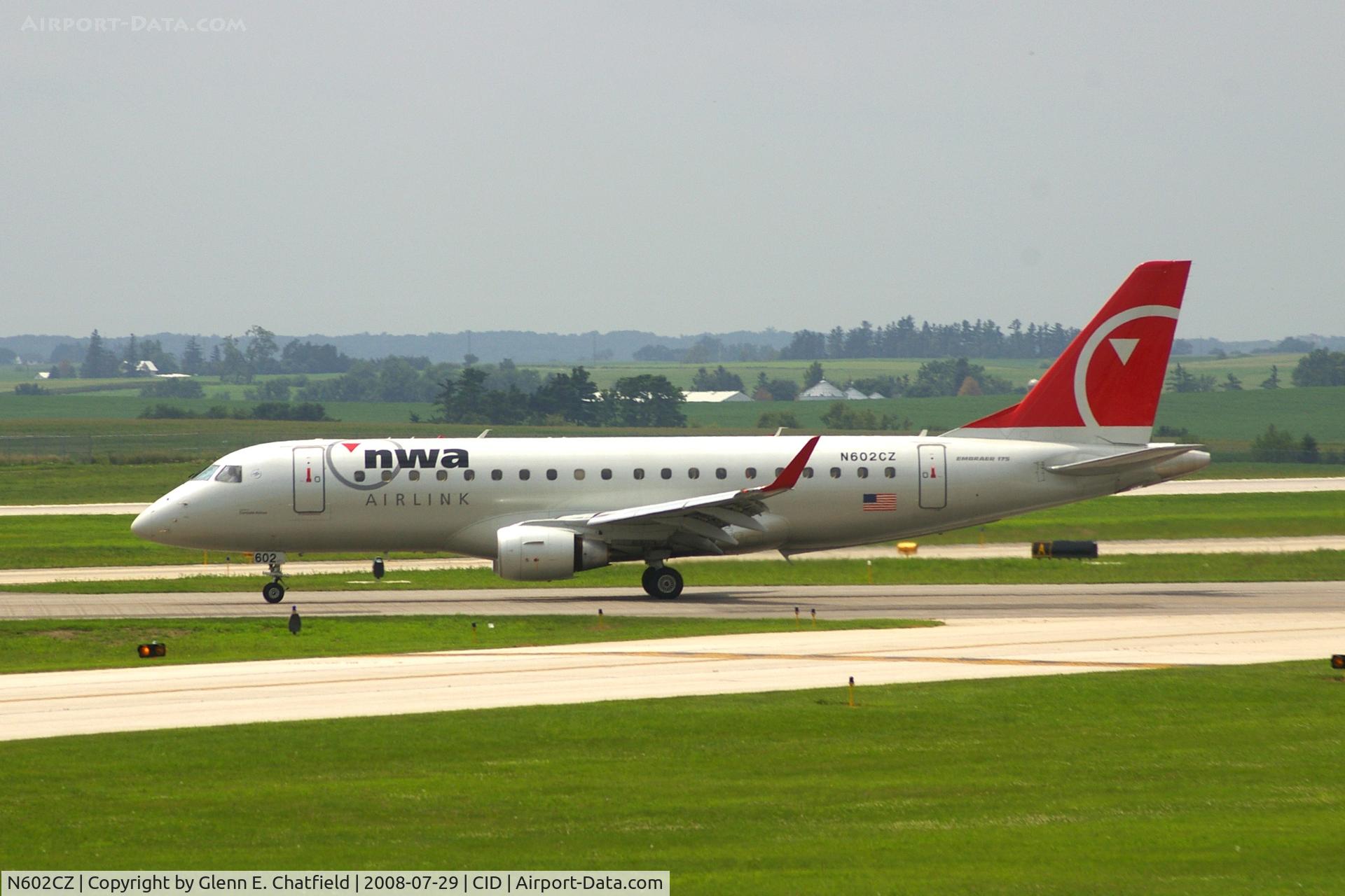 N602CZ, 2007 Embraer 175LR (ERJ-170-200LR) C/N 17000171, Take-off roll on Runway 13. Seen from second floor window of the control tower.