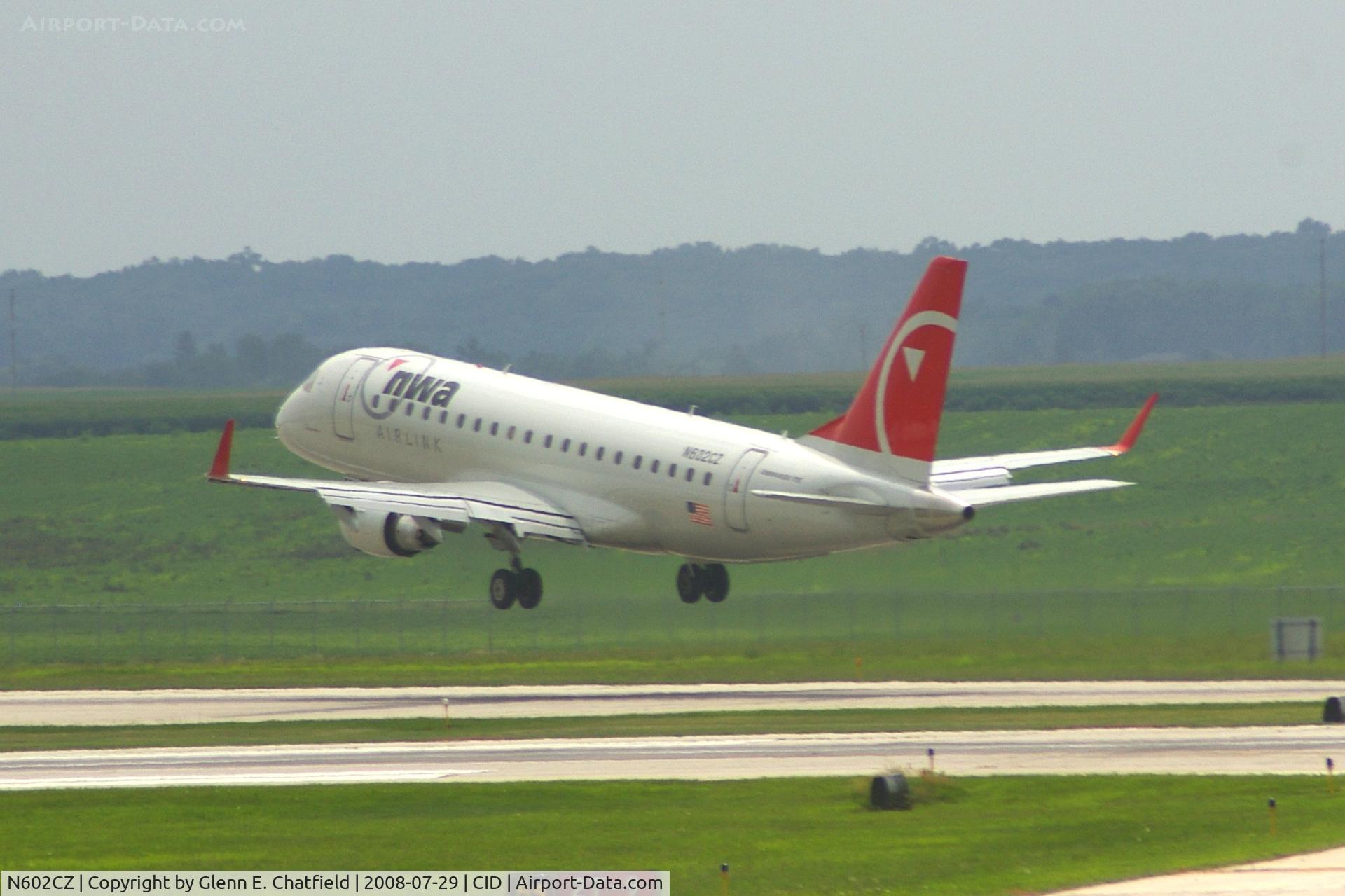 N602CZ, 2007 Embraer 175LR (ERJ-170-200LR) C/N 17000171, Taking off Runway 13. Seen from second floor window of the control tower.