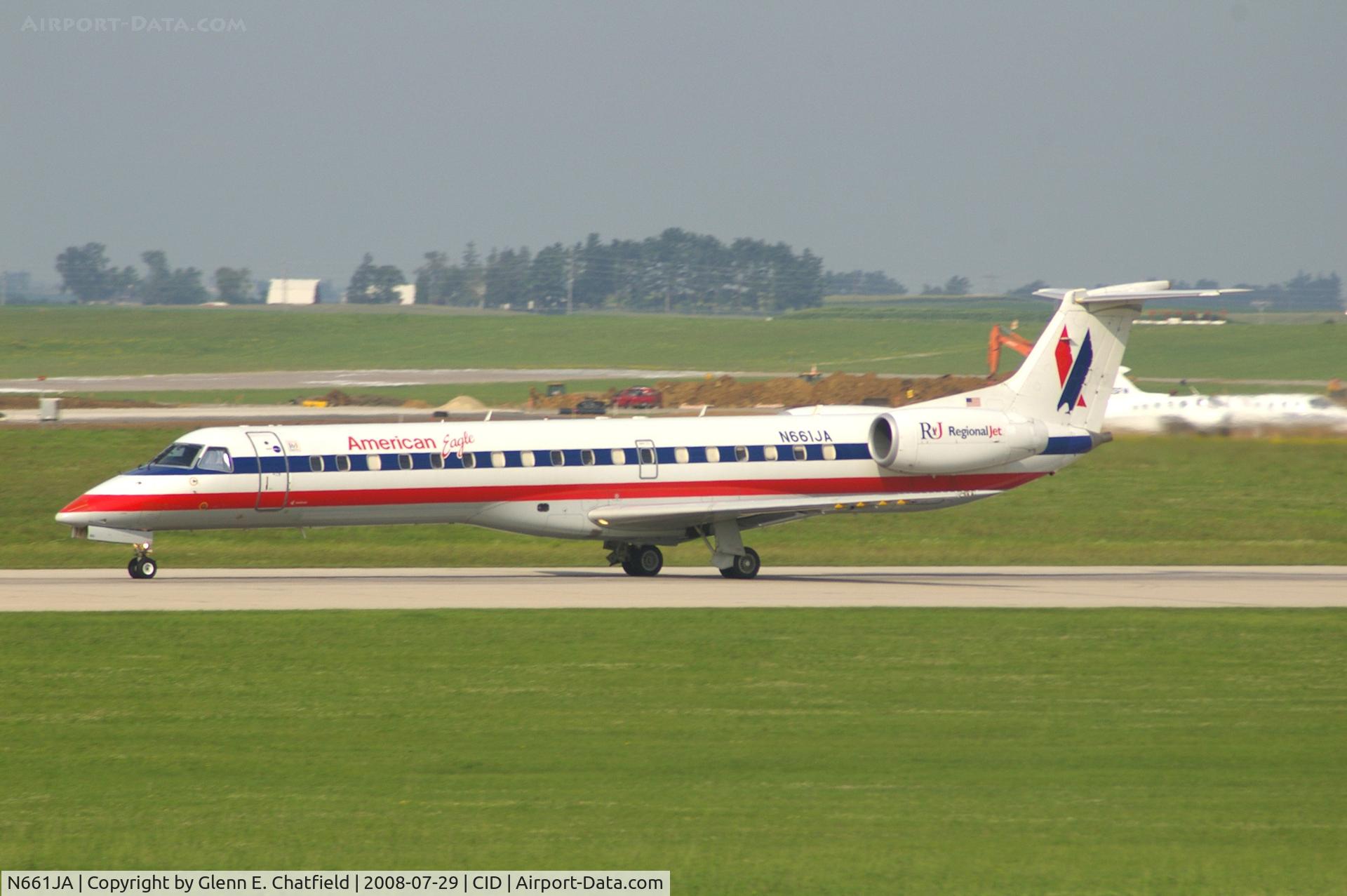 N661JA, 2003 Embraer ERJ-145LR (EMB-145LR) C/N 145766, Take-off roll on Runway 13. Seen from second floor window of the control tower.