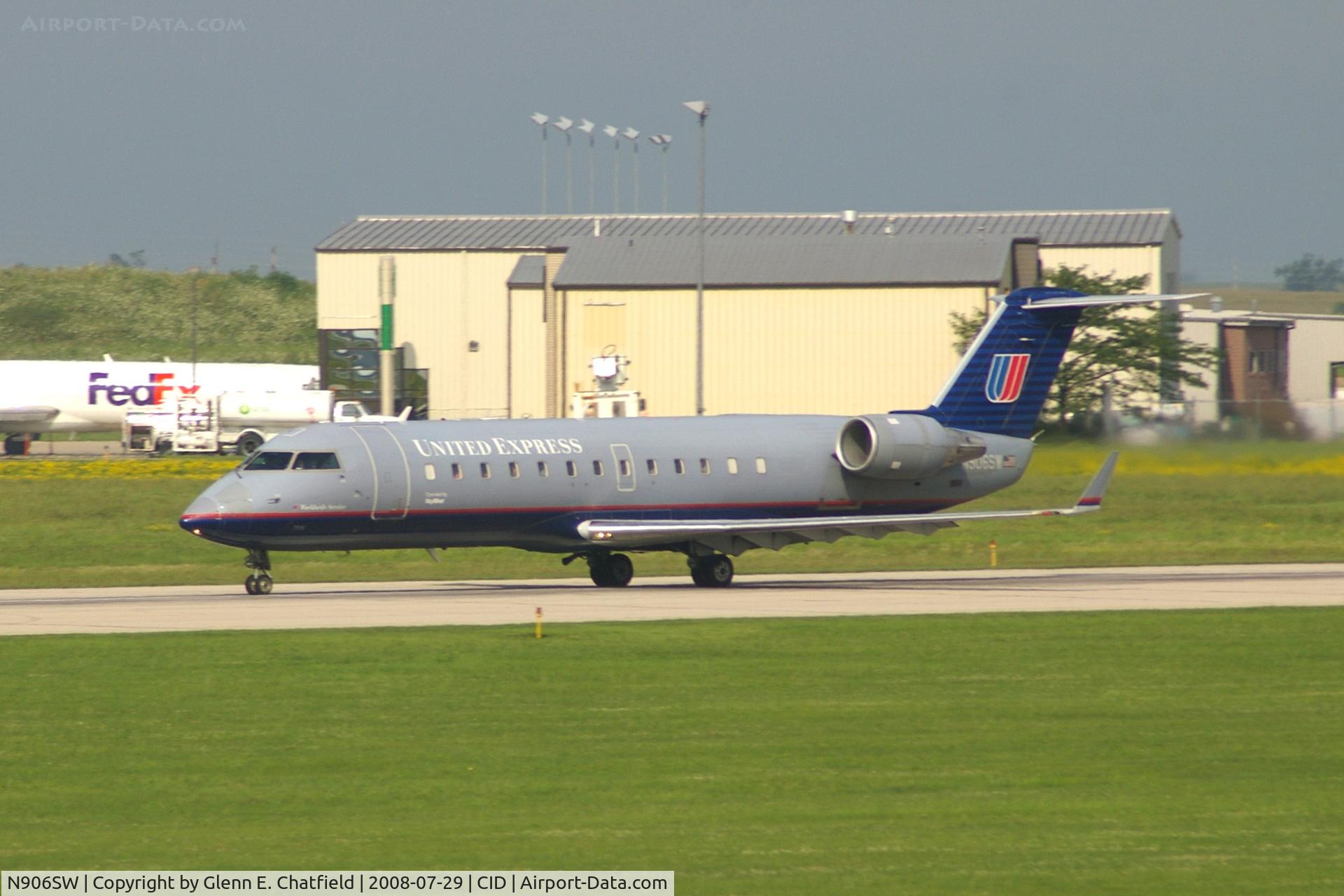 N906SW, 2001 Bombardier CRJ-200LR (CL-600-2B19) C/N 7510, Take-off roll on Runway 13. Seen from second floor window of the control tower.