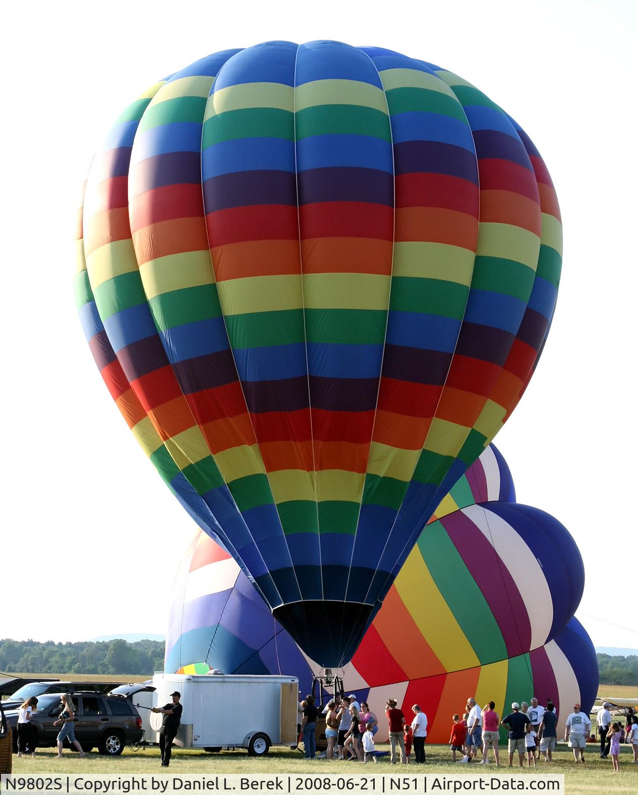 N9802S, Adams Balloon A55 C/N 177, A colorful balloon prepares for lift off into the summer evening sky.