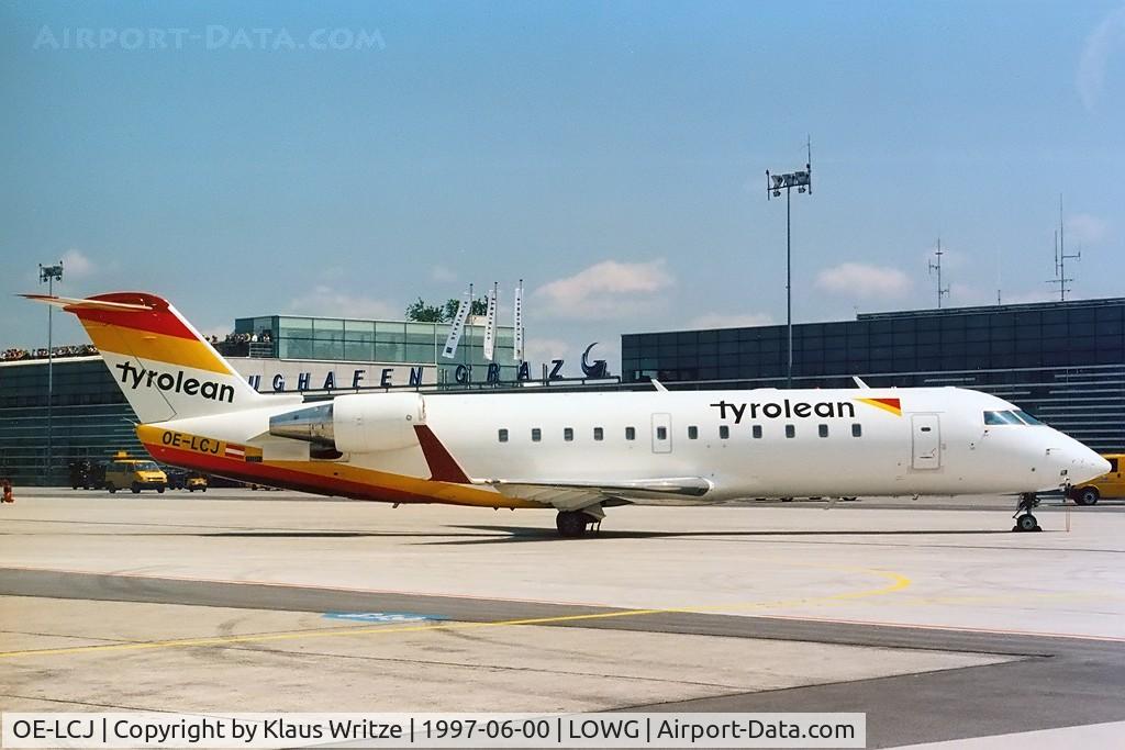 OE-LCJ, 1996 Canadair CRJ-200LR (CL-600-2B19) C/N 7142, With the old terminal in the background