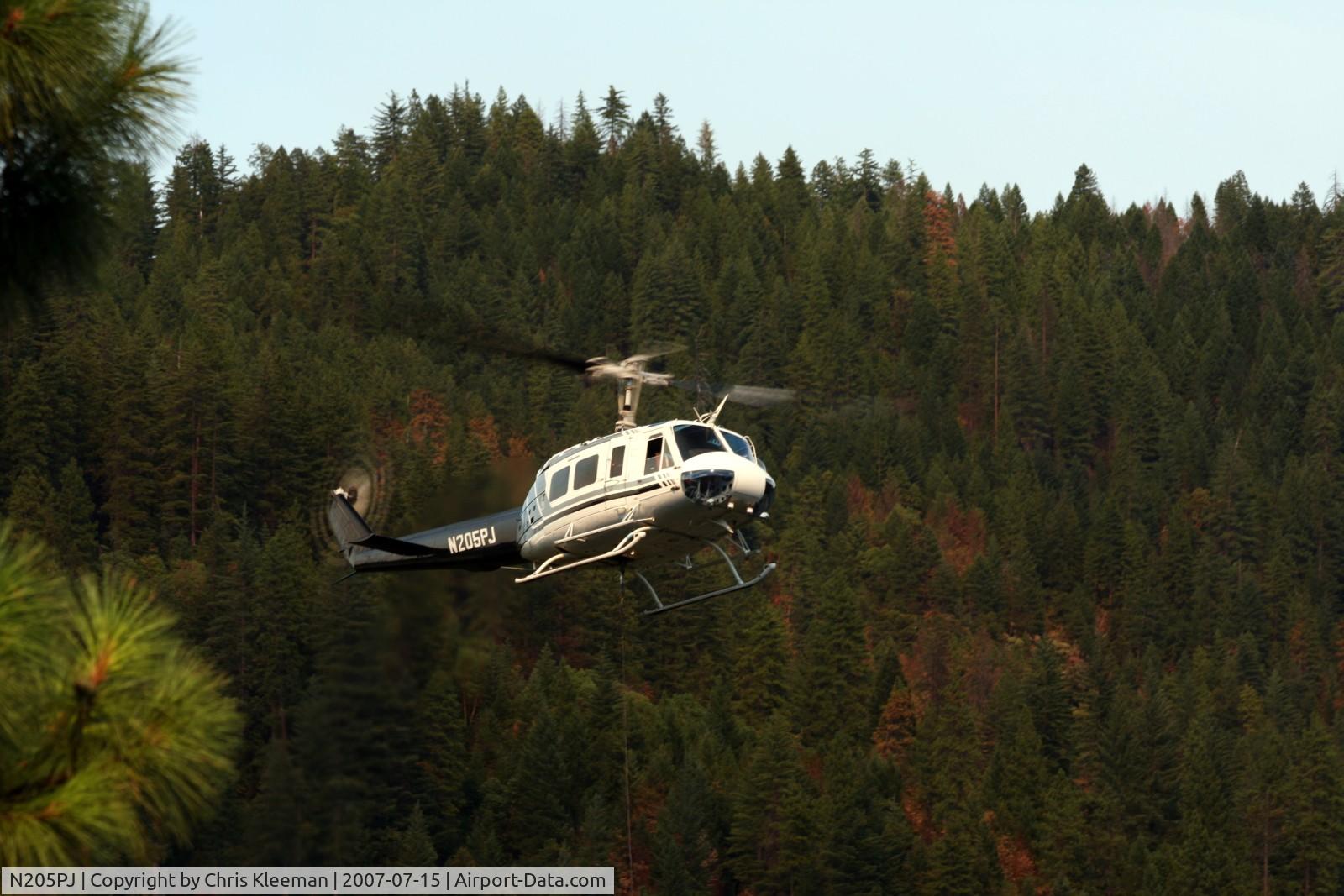 N205PJ, 1964 Bell UH-1H Iroquois C/N 4324, Doing bucket drops on fires around Happy Camp,CA