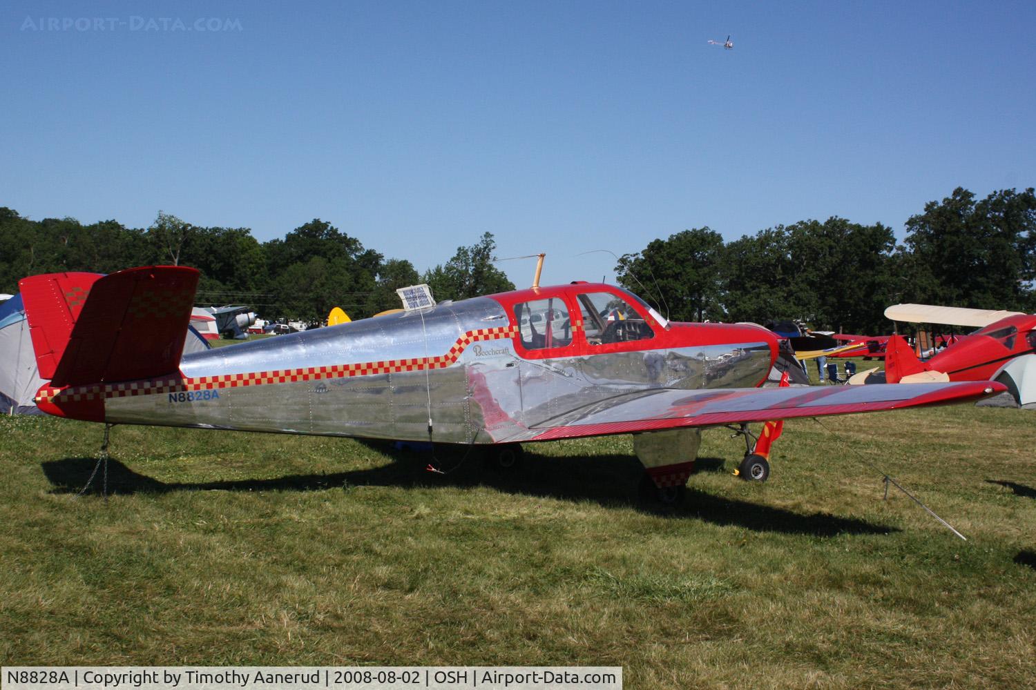 N8828A, 1950 Beech B35 C/N D-2373, EAA AirVenture 2008, note the solar panel on the top of the fuselage. It might be some sort of battery charger.