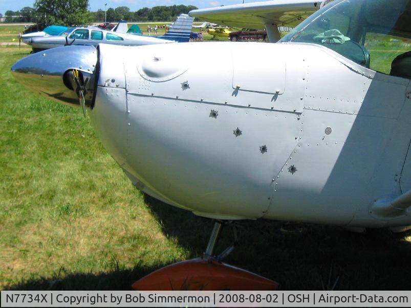 N7734X, 1961 Cessna 172B C/N 17248234, Complete with simulated bullet holes.  Airventure 2008 - Oshkosh, WI
