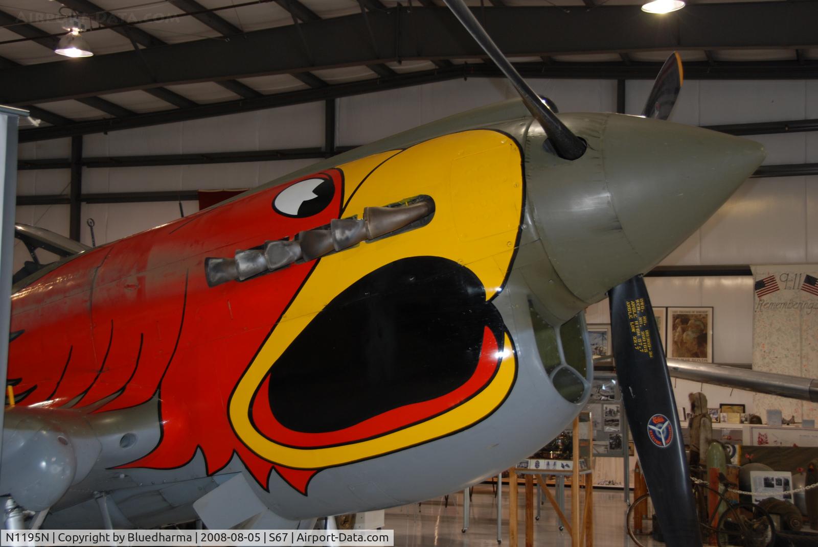 N1195N, 1942 Curtiss P-40N Warhawk C/N 130158, Parrot head P40 on display at Warhawk Air Museum.