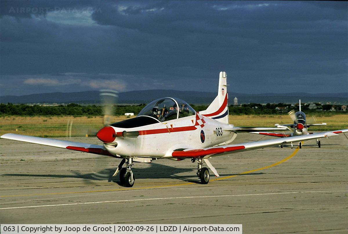 063, Pilatus PC-9M C/N 626, In the last light of the day these PC-9 return from a training flight. The sun makes it barely over the horizon.