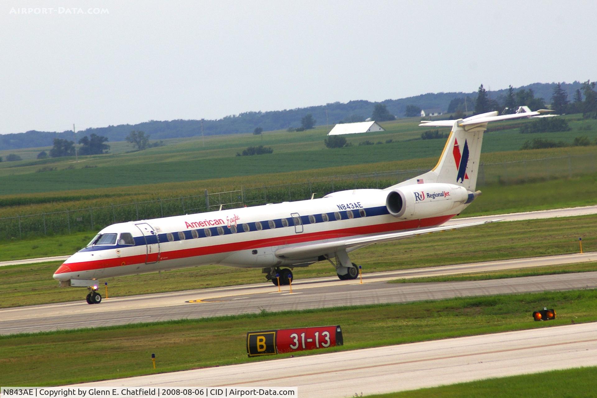 N843AE, 2003 Embraer ERJ-140LR (EMB-135KL) C/N 145680, Taxiing on Alpha to the ramp.  Looking through my dirty window.