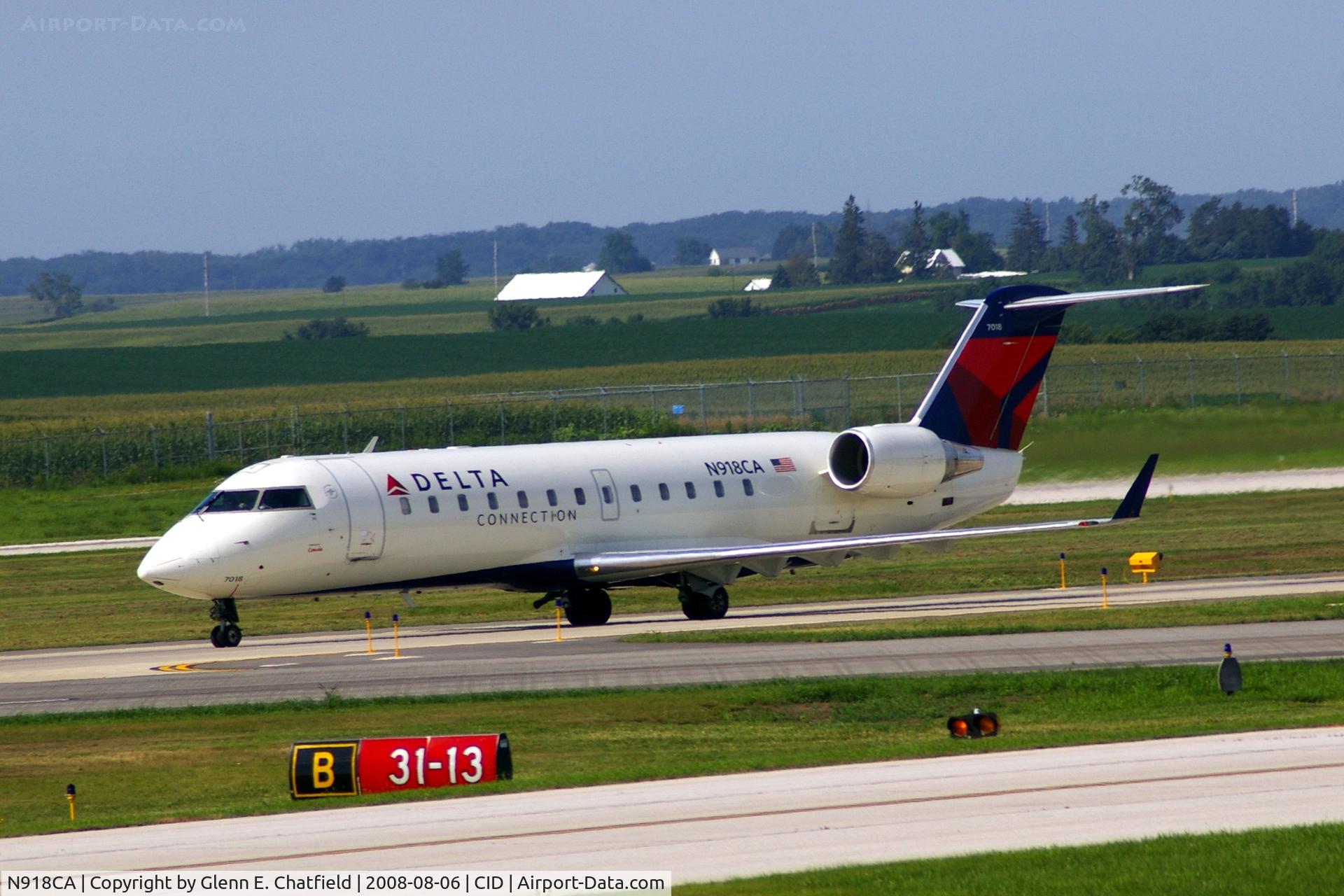 N918CA, 1993 Canadair CRJ-100ER (CL-600-2B19) C/N 7018, Taxiing on Alpha to the ramp.  Looking through my dirty window.