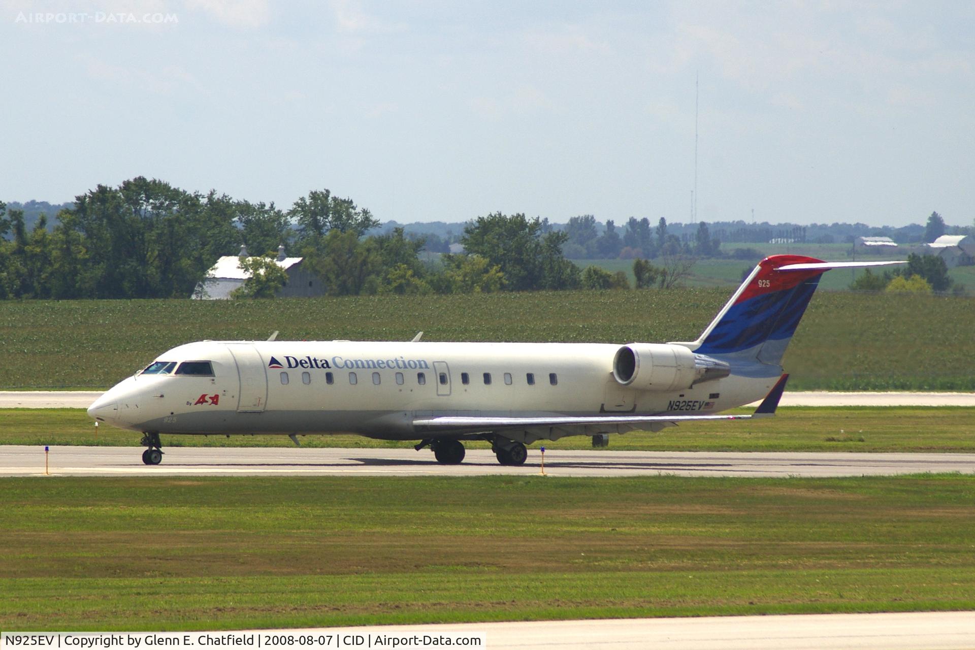 N925EV, 2003 Bombardier CRJ-200ER (CL-600-2B19) C/N 7831, Taxiing on Alpha to the ramp.  Looking through my dirty window.
