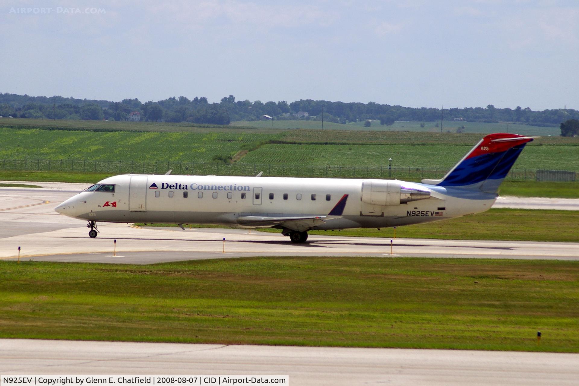 N925EV, 2003 Bombardier CRJ-200ER (CL-600-2B19) C/N 7831, Taxiing on Alpha to the ramp.  Looking through my dirty window.