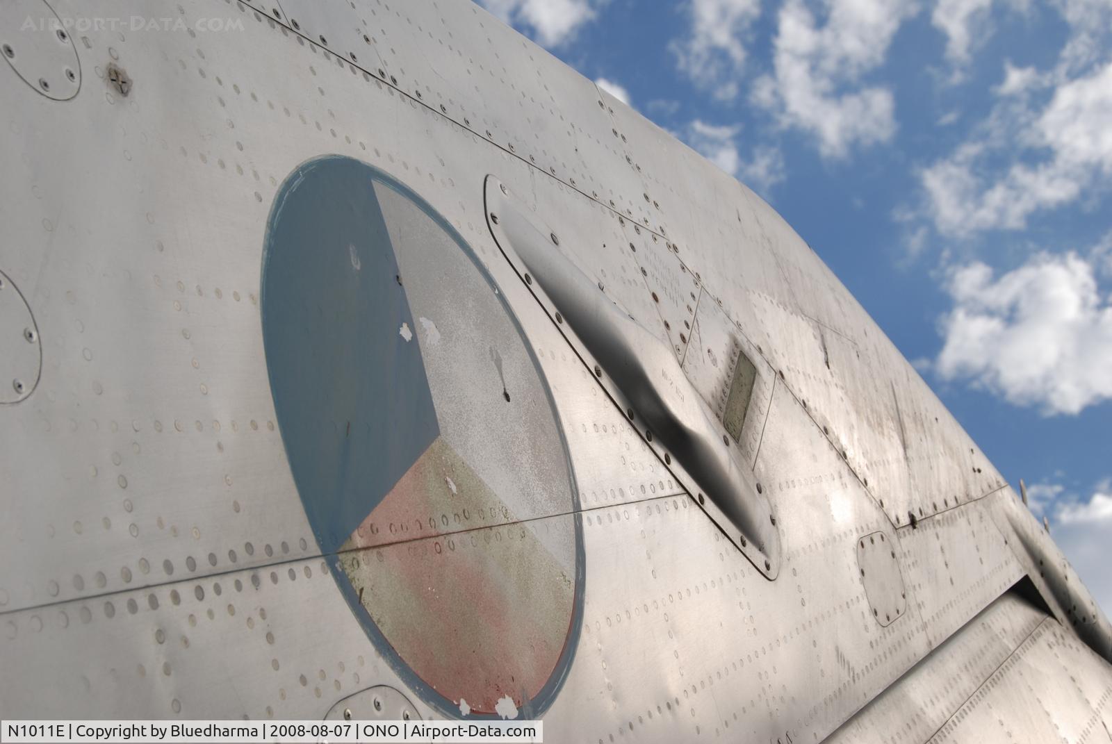 N1011E, Mikoyan-Gurevich MiG-21F-13 C/N 1011, Parked by hanger at airport.