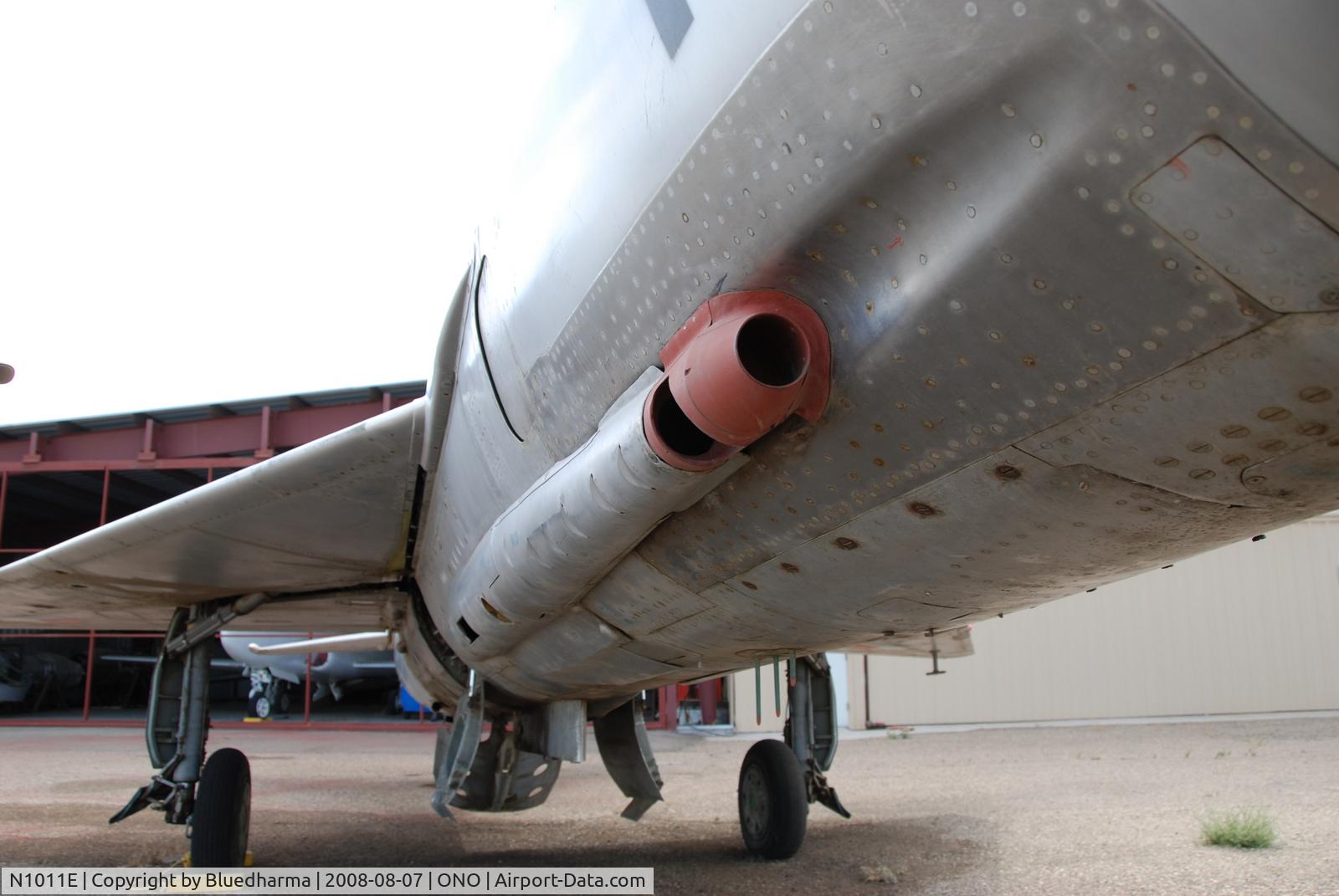 N1011E, Mikoyan-Gurevich MiG-21F-13 C/N 1011, Parked by hanger at airport.