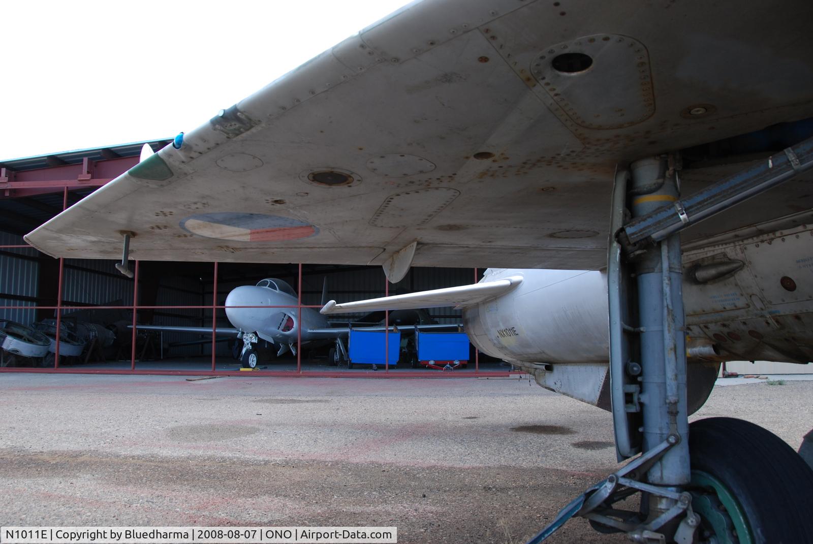 N1011E, Mikoyan-Gurevich MiG-21F-13 C/N 1011, Parked by hanger at airport.