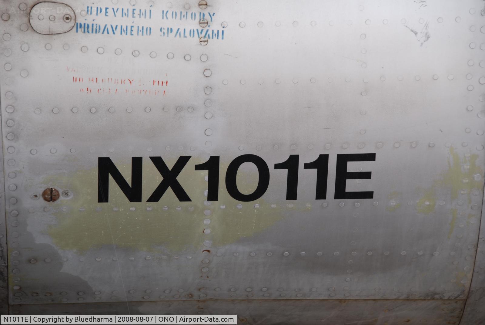 N1011E, Mikoyan-Gurevich MiG-21F-13 C/N 1011, Parked by hanger at airport.