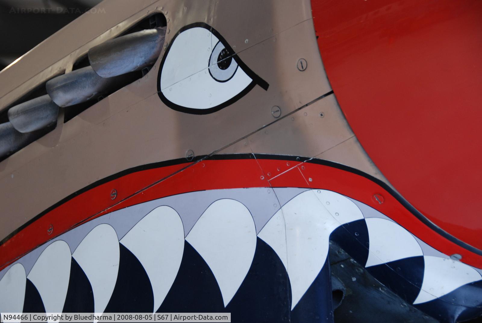 N94466, 1942 Curtiss P-40E C/N AK-899, Flying Tiger Nose art detail. On display at the Warhawk Air Museum.