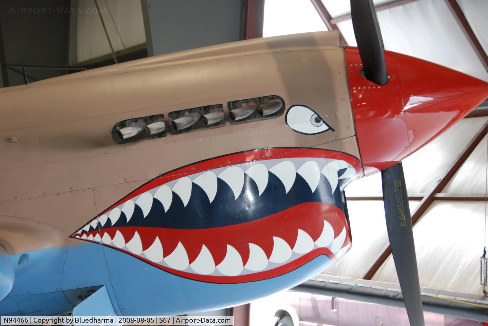 N94466, 1942 Curtiss P-40E C/N AK-899, Flying Tiger Nose Art. On display at the Warhawk Air Museum.