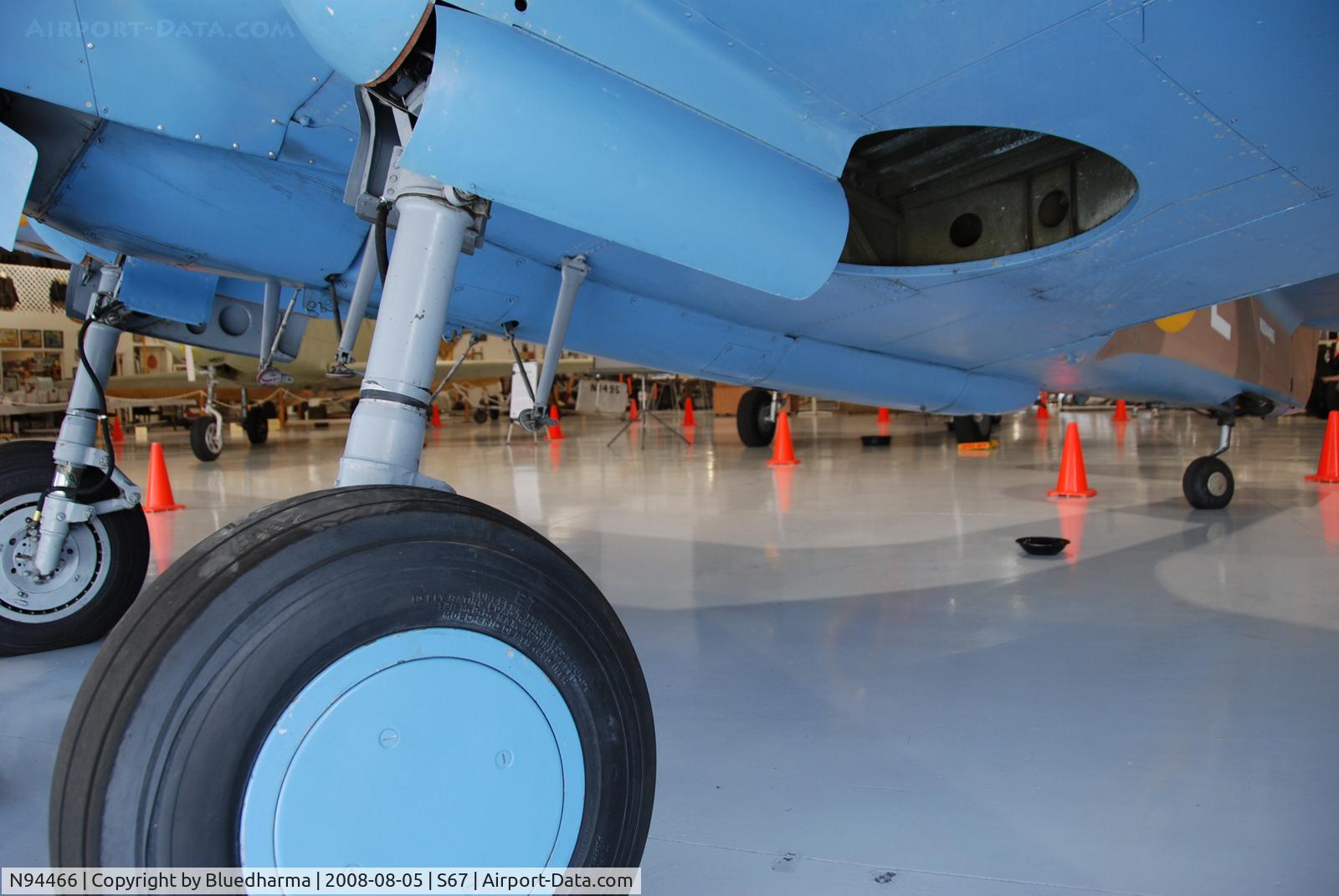 N94466, 1942 Curtiss P-40E C/N AK-899, Flying Tiger wheel and undercarriage detail. On display at the Warhawk Air Museum.