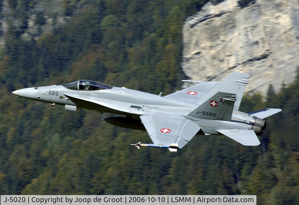 J-5020, McDonnell Douglas F/A-18C Hornet C/N 1369/SFC020, Directly after take off the Hornet banks left to avoid mountains that are in front of the runway.