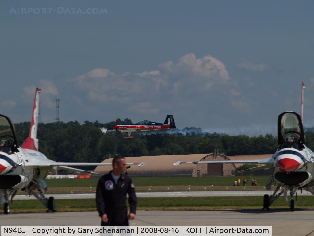 N94BJ, 2002 Extra EA-300S C/N 031, IN BETWEEN TWO THUNDERBIRDS
