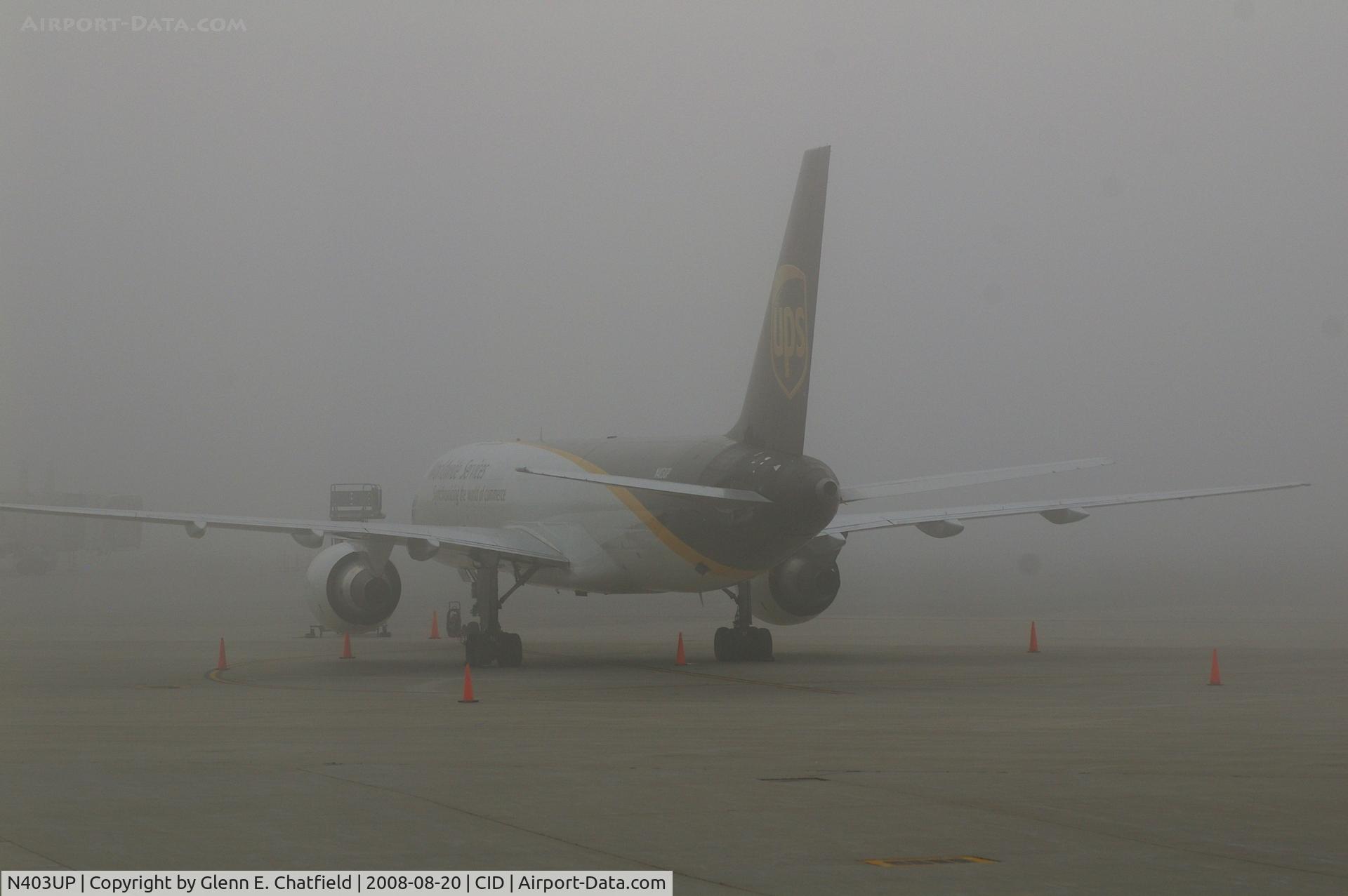 N403UP, 1987 Boeing 757-24APF C/N 23725, Early morning fog on the UPS ramp.