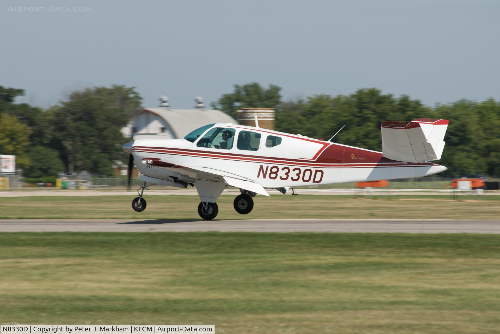N8330D, 1958 Beech J35 Bonanza C/N D-5483, N8330D touches down in a light crosswind