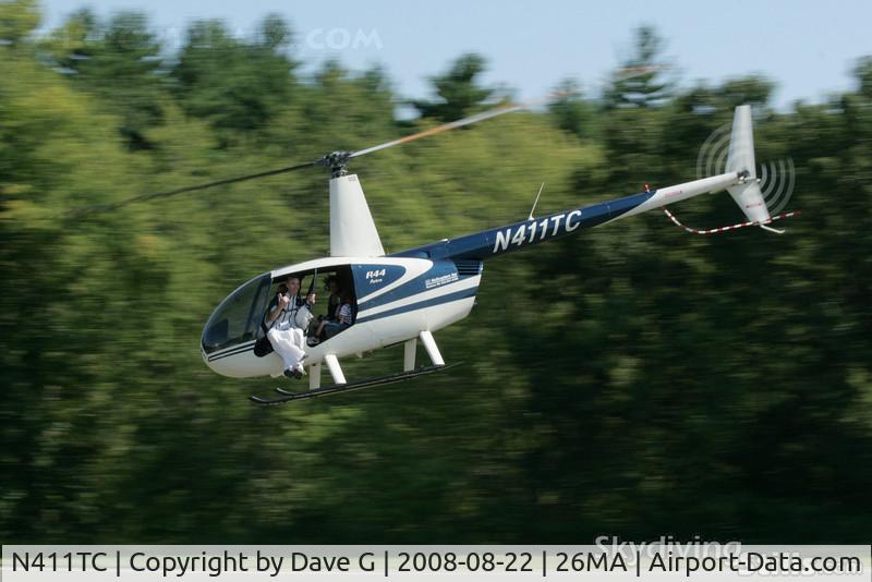 N411TC, 1994 Robinson R44 C/N 0034, R-44 departs with a wingsuit-equipped skydiver in the door.