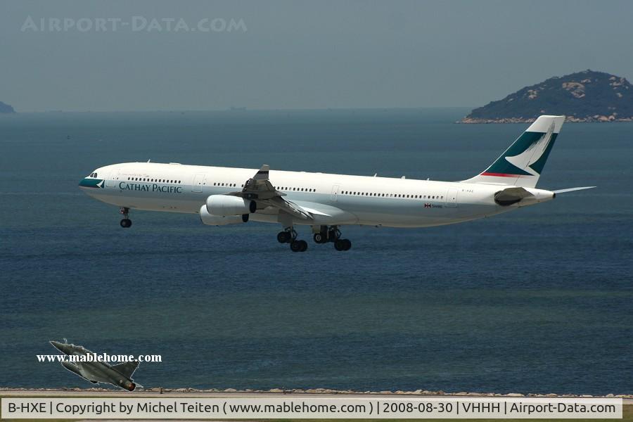 B-HXE, 1996 Airbus A340-313 C/N 157, Cathay Pacific touching down on runway 25R