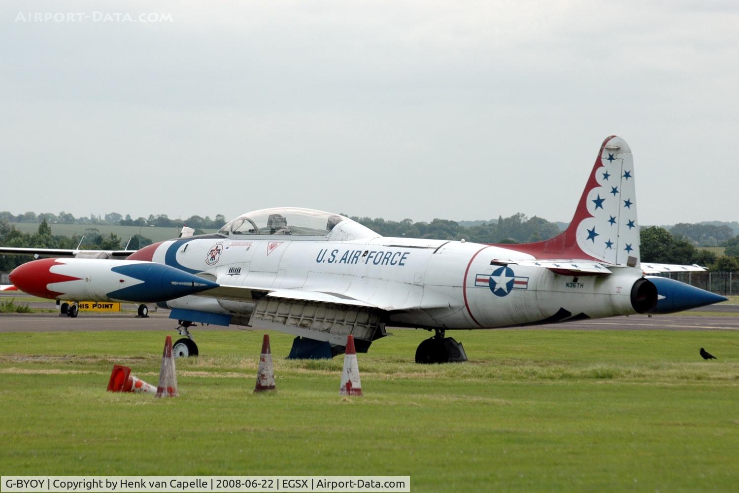 G-BYOY, Canadair T-33AN Silver Star 3 C/N T33-231, G-BYOY standing in the grass at North Weald, still showing its previous registration N36TH.
