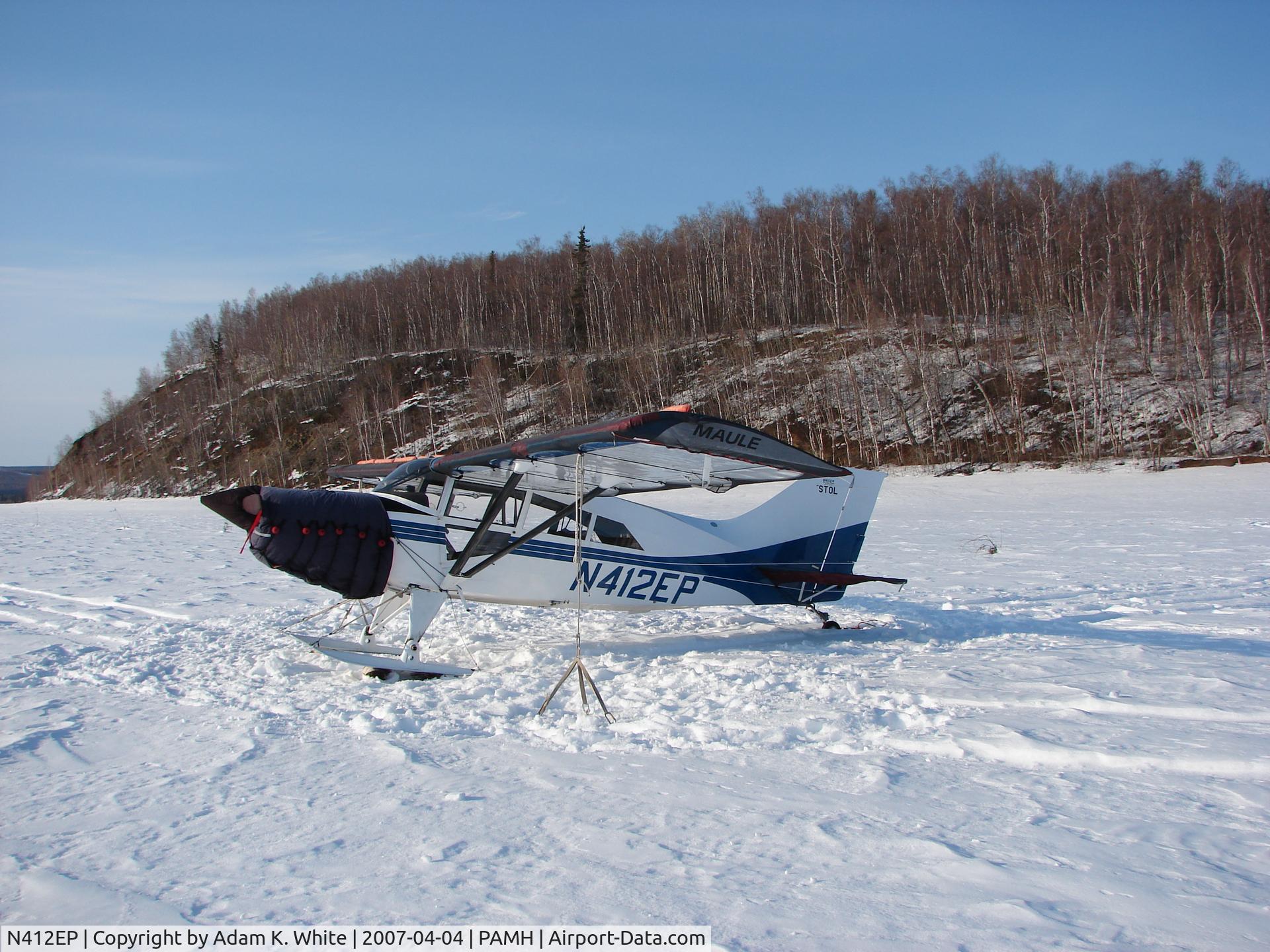 N412EP, 2003 Maule M-7-235B Super Rocket C/N 23073C, On skis with engine and wing covers on.