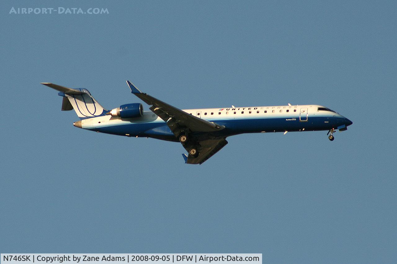 N746SK, 2005 Bombardier CRJ-700 (CL-600-2C10) Regional Jet C/N 10202, Landing 13R at DFW - taken from Southlake Carrol High School football stadium during the Friday night game.