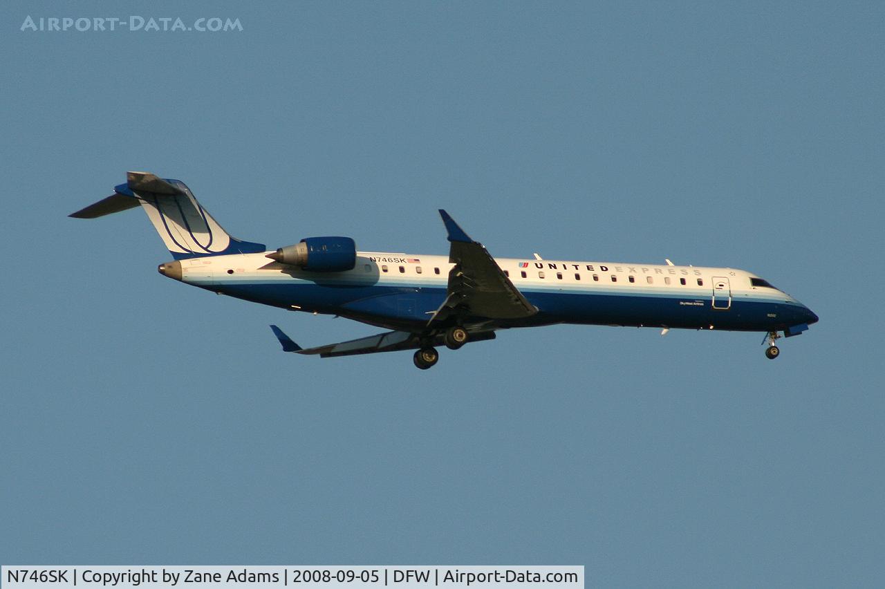 N746SK, 2005 Bombardier CRJ-700 (CL-600-2C10) Regional Jet C/N 10202, Landing 13R at DFW - taken from Southlake Carrol High School football stadium during the Friday night game.