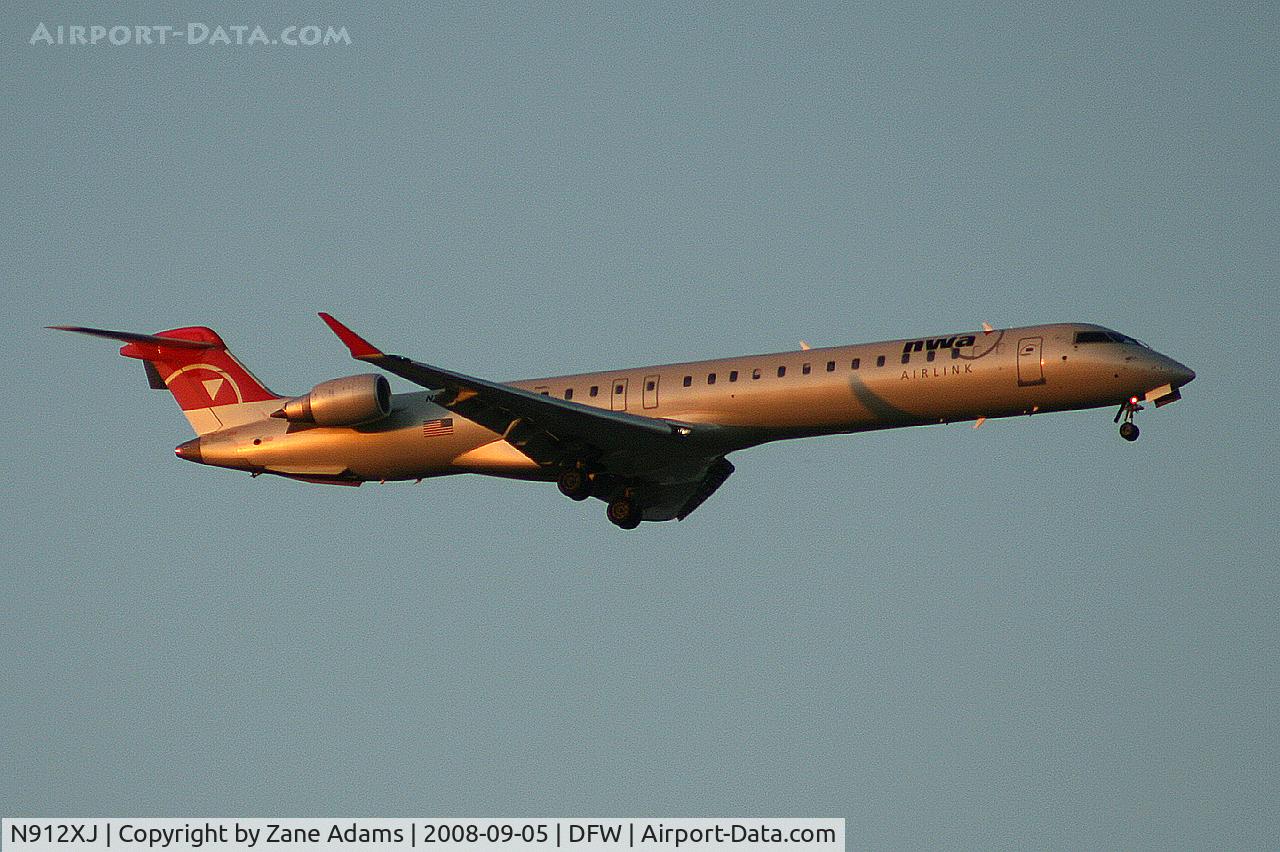 N912XJ, 2007 Bombardier CRJ-900ER (CL-600-2D24) C/N 15144, Landing 13R at DFW - taken from Southlake Carrol High School football stadium during the Friday night game.