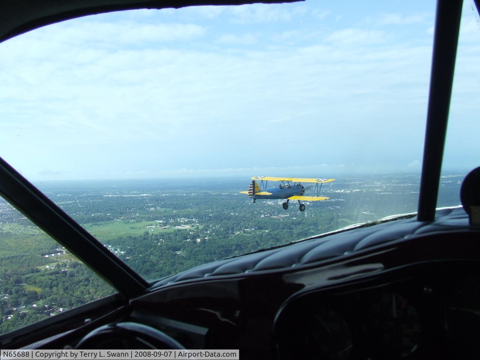 N65688, Boeing E75 C/N 75-8469, Air to Air from a Stinson SR-9C.