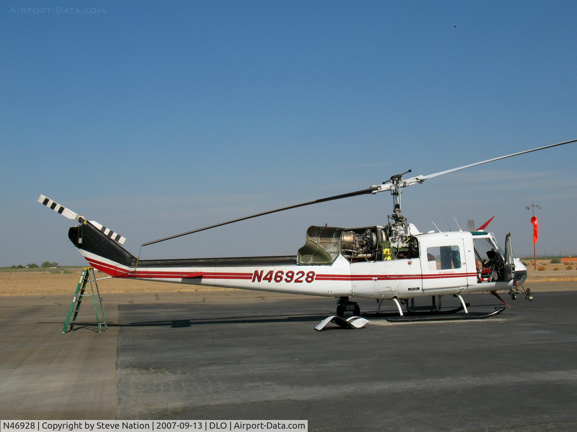 N46928, Bell UH-1B C/N 61-0712, San Joaquin Helicopters 1961 Bell UH-1B minus panels @ Delano, CA