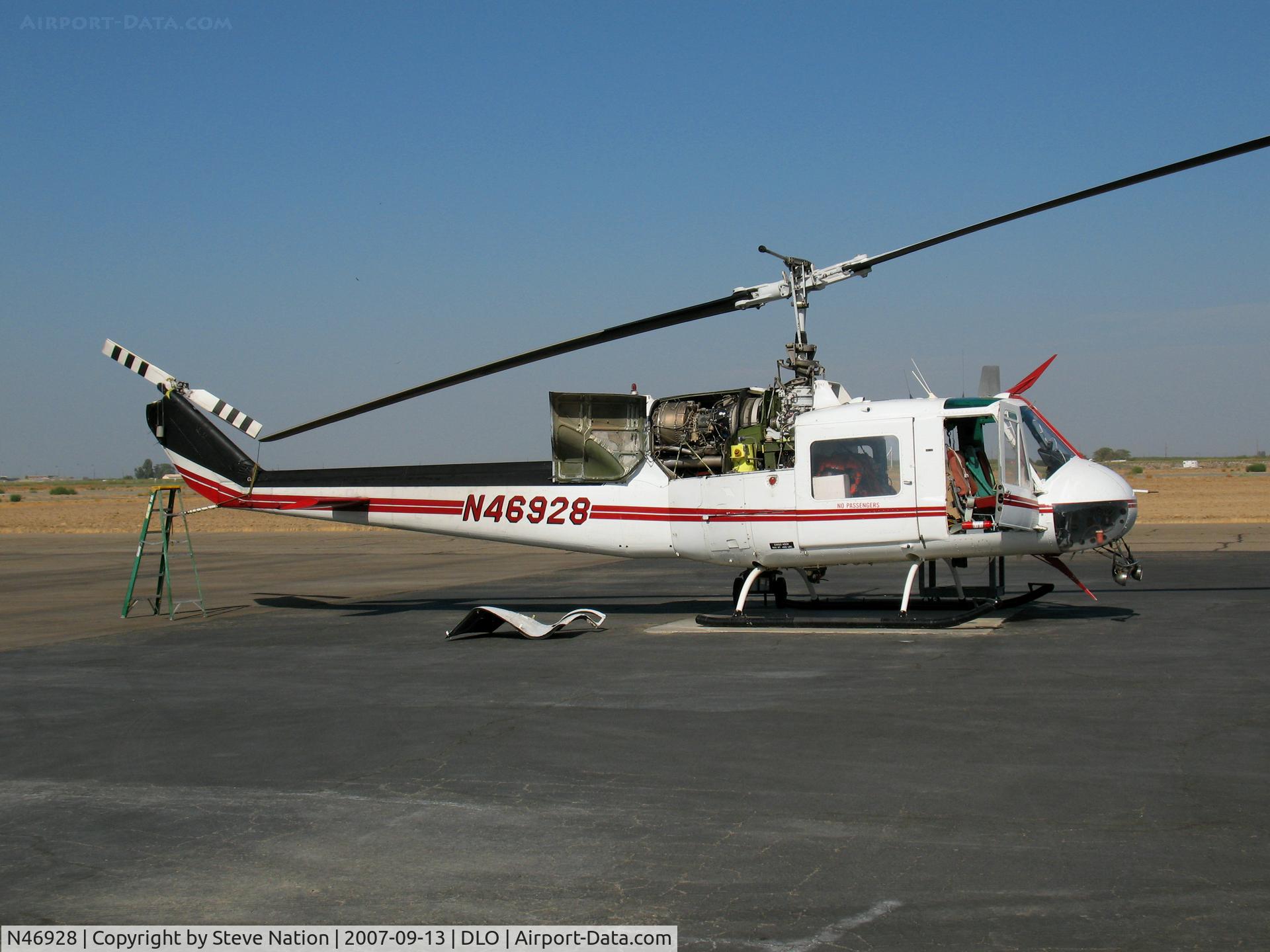 N46928, Bell UH-1B C/N 61-0712, San Joaquin Helicopters 1961 Bell UH-1B minus panels @ Delano, CA