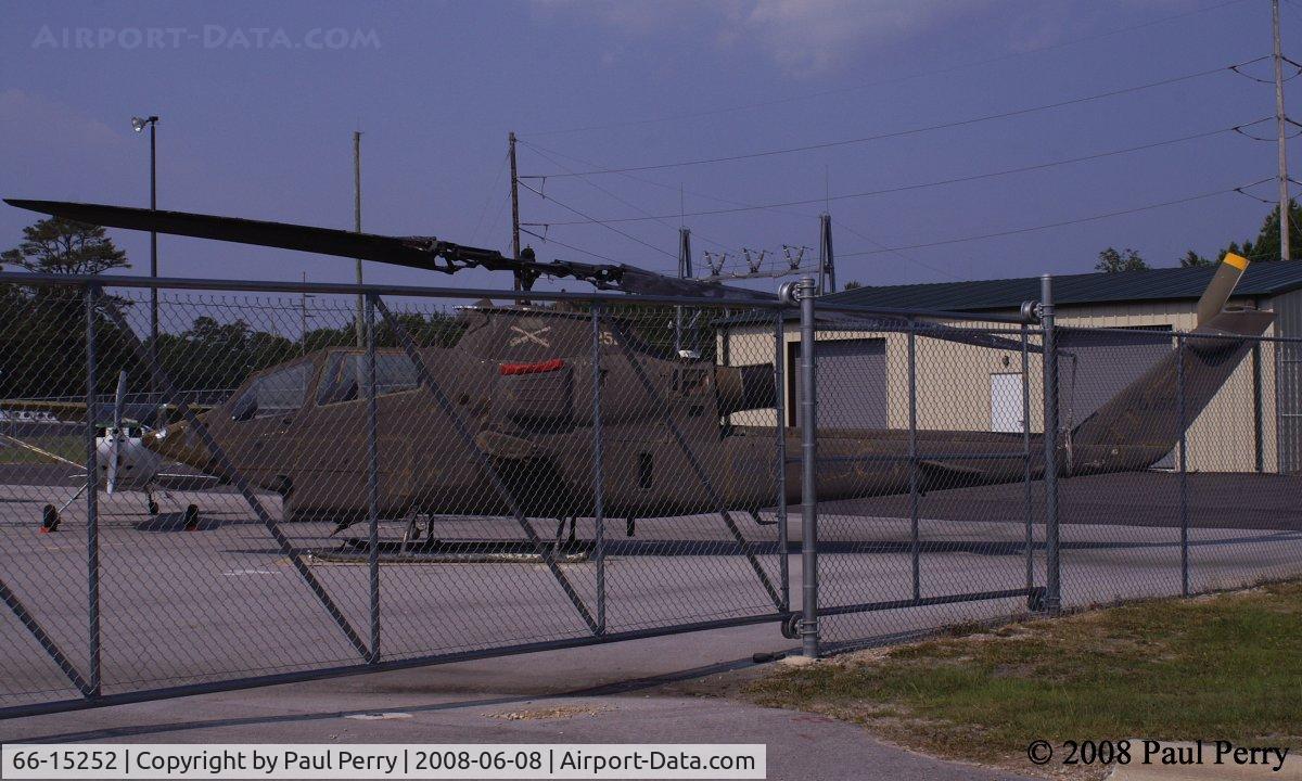 66-15252, 1966 Bell AH-1F Cobra C/N 20008, Familiar sight, a military helo inside a fence.  Nice to see a Cobra though