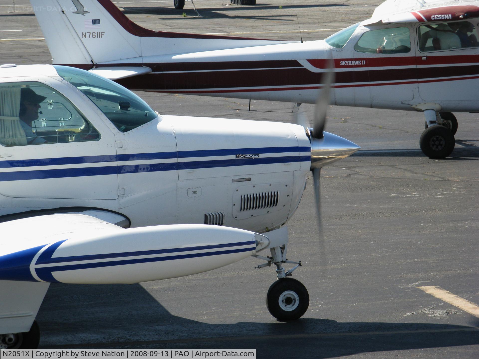 N2051X, 1978 Beech A36 Bonanza 36 C/N E-1411, Close-up of 1978 Beech A36 running up engine by tower @ Palo Alto, CA
