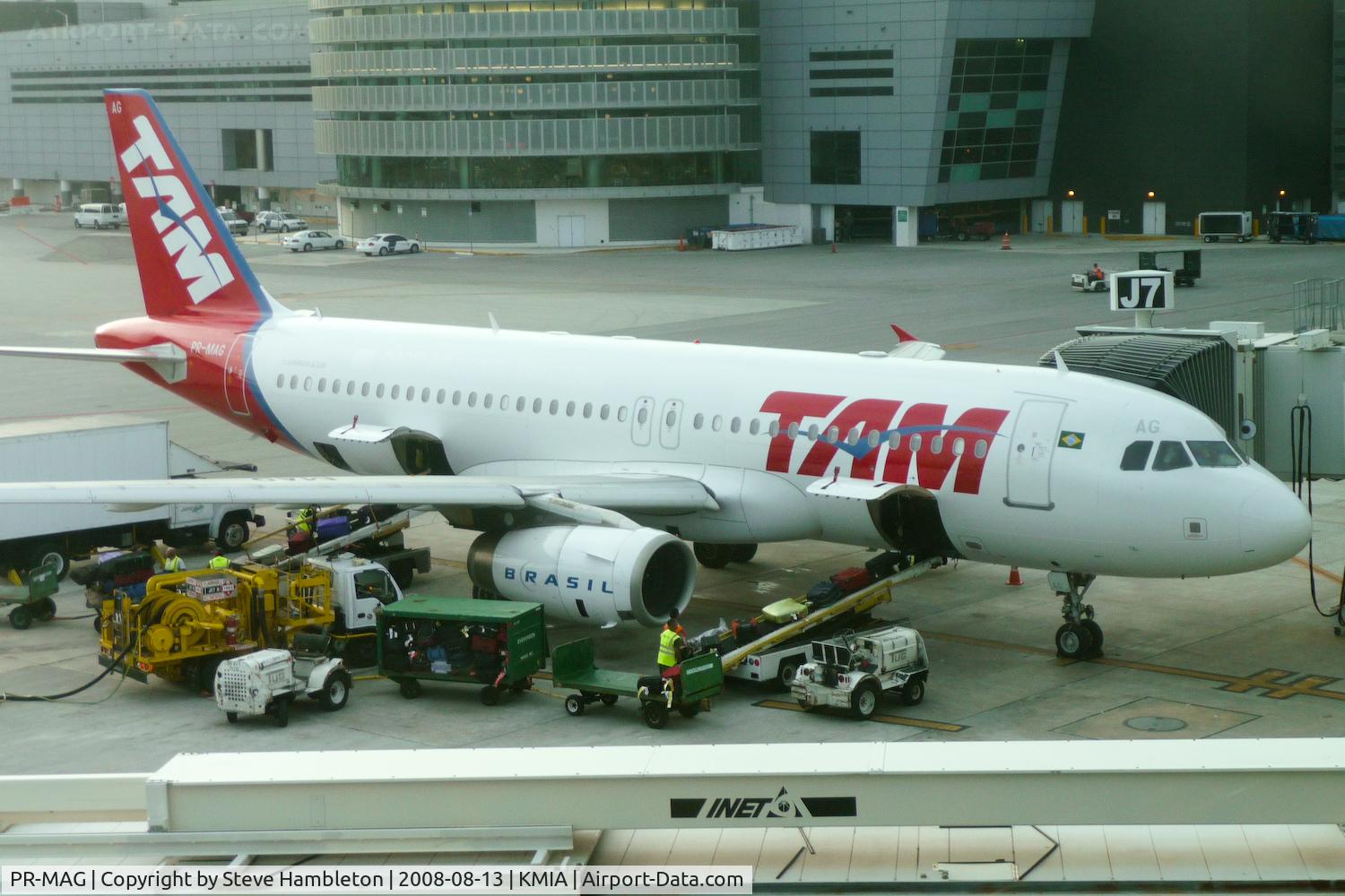 PR-MAG, 2004 Airbus A320-232 C/N 1832, TAM A.319 through the window at Miami