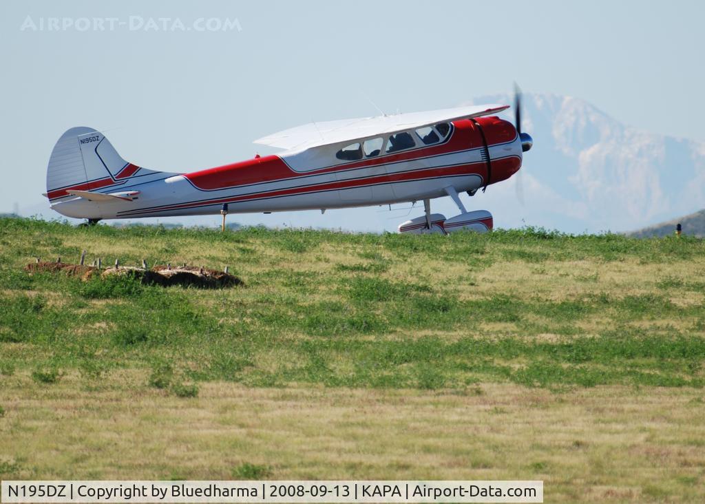 N195DZ, 1953 Cessna 195B Businessliner C/N 16077, Position and hold for 17L with Pikes Peak in the Distance.