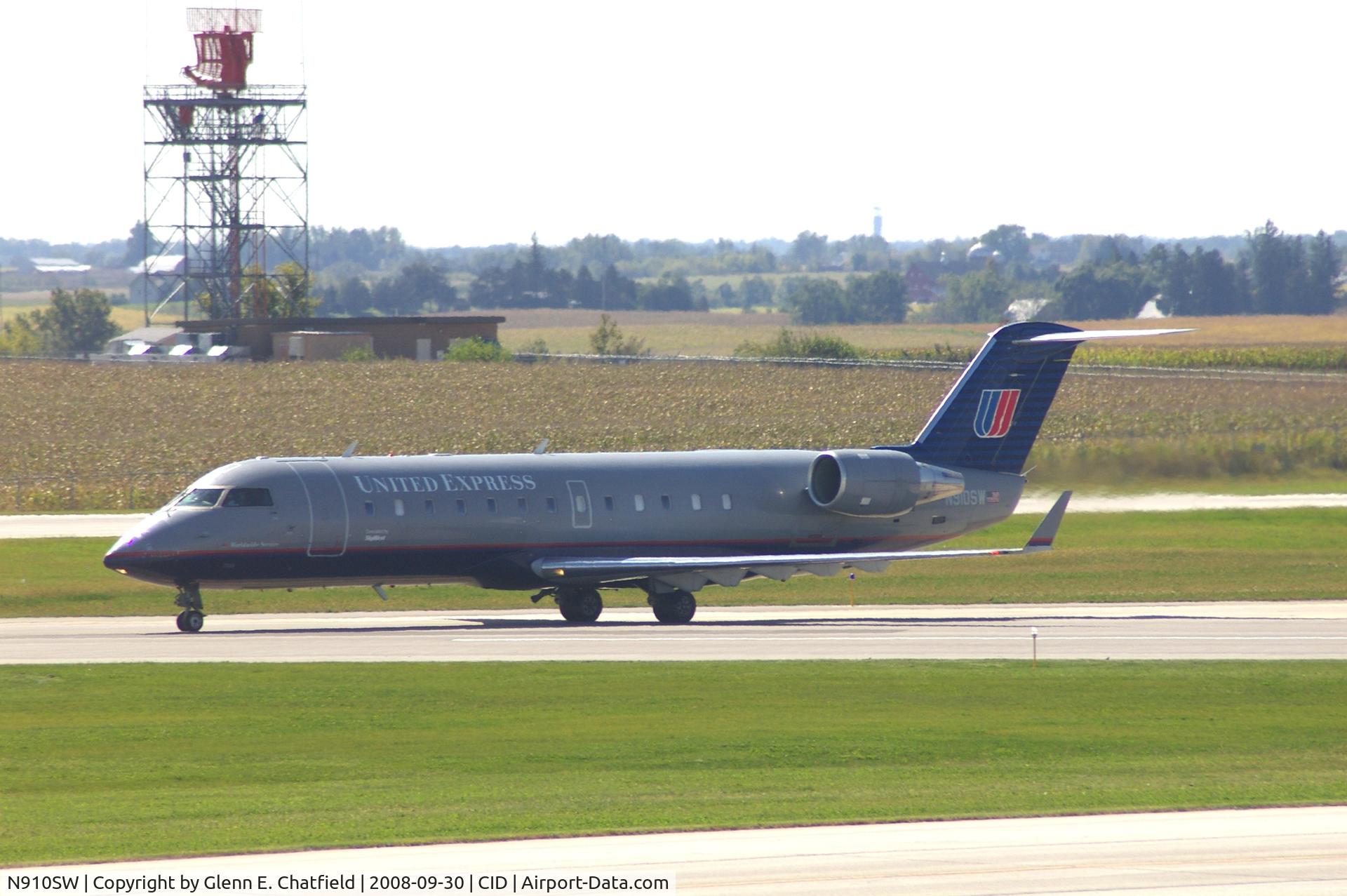 N910SW, 2001 Bombardier CRJ-200LR (CL-600-2B19) C/N 7566, Taxiing on Alpha to the ramp.  Looking through my dirty window.