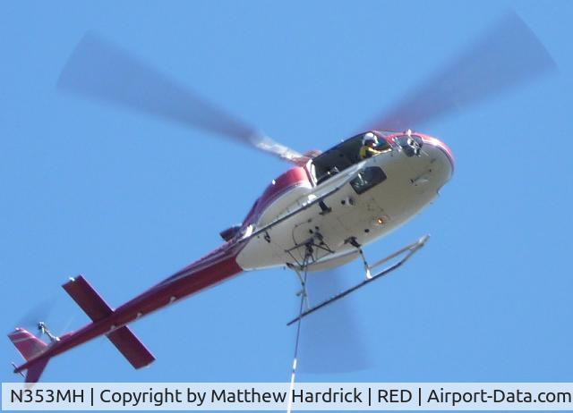 N353MH, 1999 Eurocopter AS-350B-3 Ecureuil Ecureuil C/N 3267, Helicopter N353MH performing a water bucket drop.