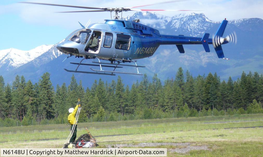 N6148U, 1997 Bell 407 C/N 53217, 48U taking part in sling load hook-up training.