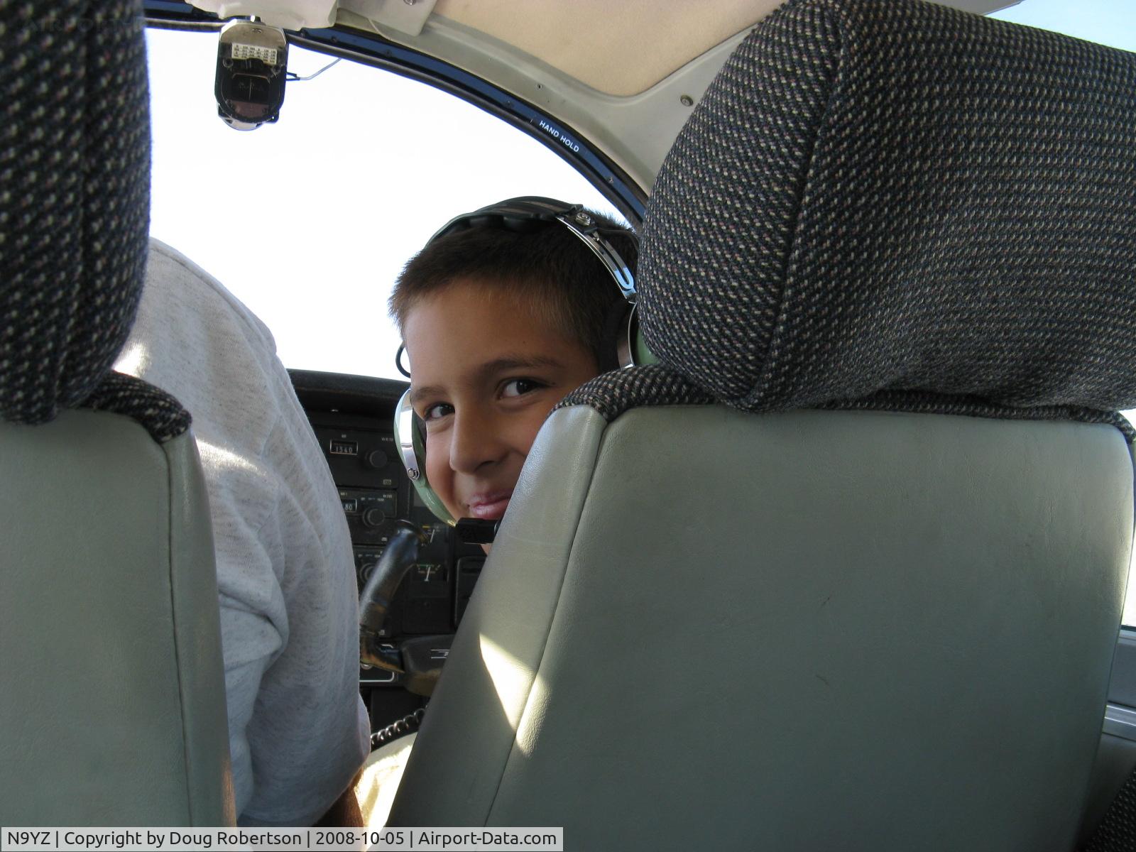 N9YZ, 1975 Grumman American AA-5A Cheetah C/N AA5-0822, 1975 Grumman American AA-5A CHEETAH, Lycoming O-320 150 Hp, aboard Young Eagles Flight from SZP with pilot Gary, Anthony is one happy kid during flight near SZP. I can't overstress the importance of the EAA's Young Eagles Program for kids 8 to 18!
