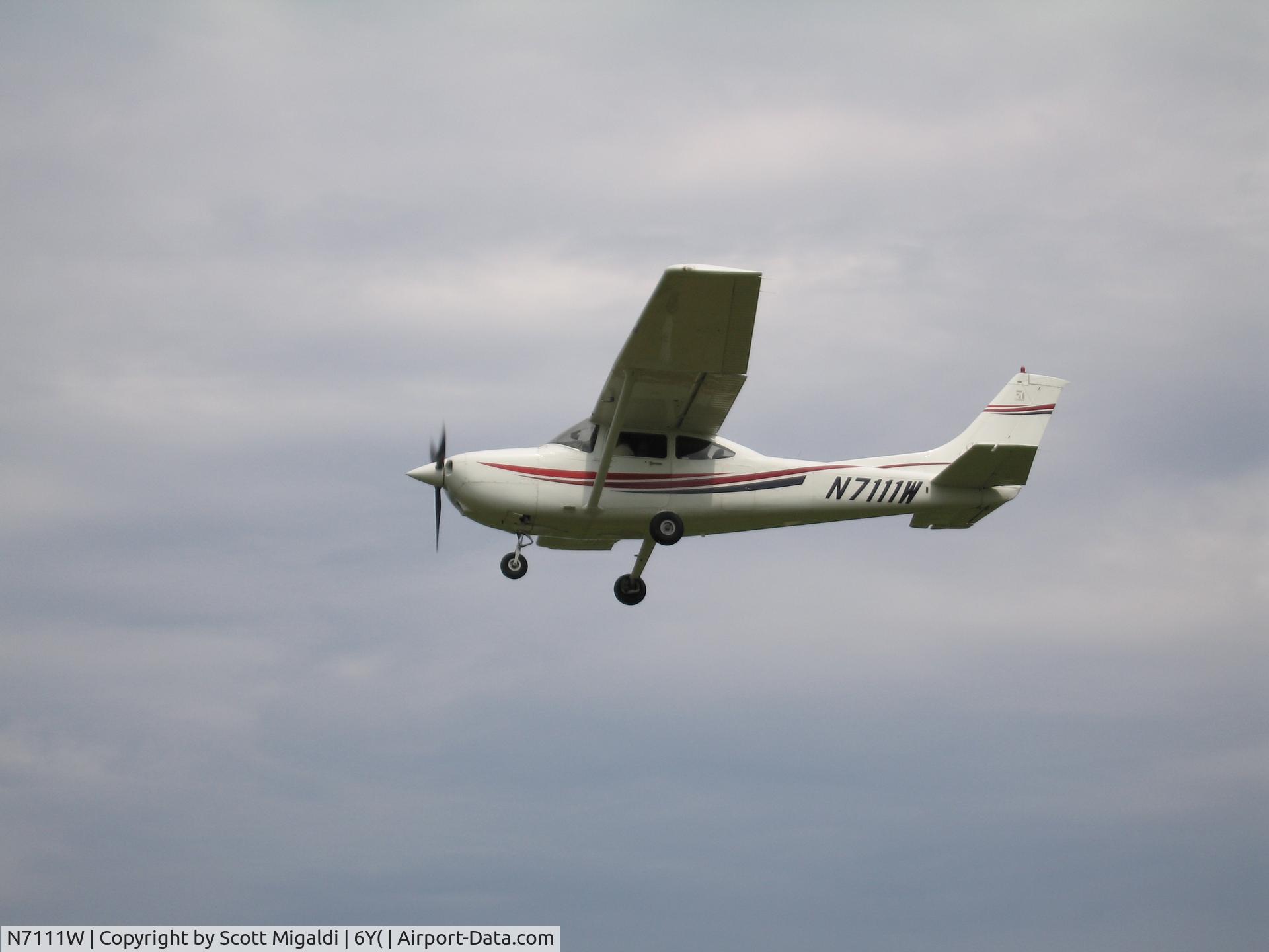 N7111W, 1999 Cessna 182S Skylane C/N 18280550, Flying over 6Y9
