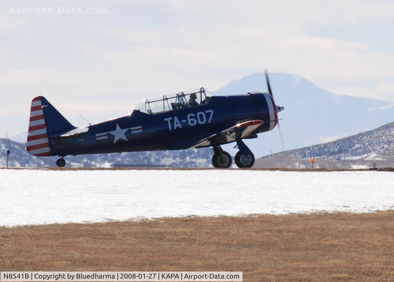 N8541B, 1943 North American T-6D C/N 41-34607-1, Position and Hold for 17L. Pikes Peak in the distance.