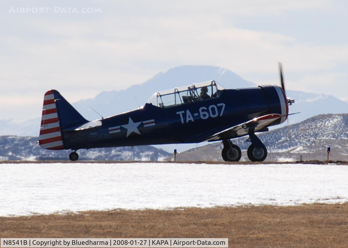 N8541B, 1943 North American T-6D C/N 41-34607-1, Position and Hold for 17L. Pikes Peak in the distance.
