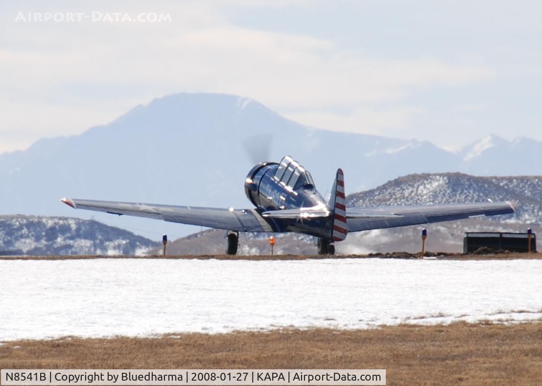 N8541B, 1943 North American T-6D C/N 41-34607-1, Takeoff on 17L. Pikes peak in the distance.