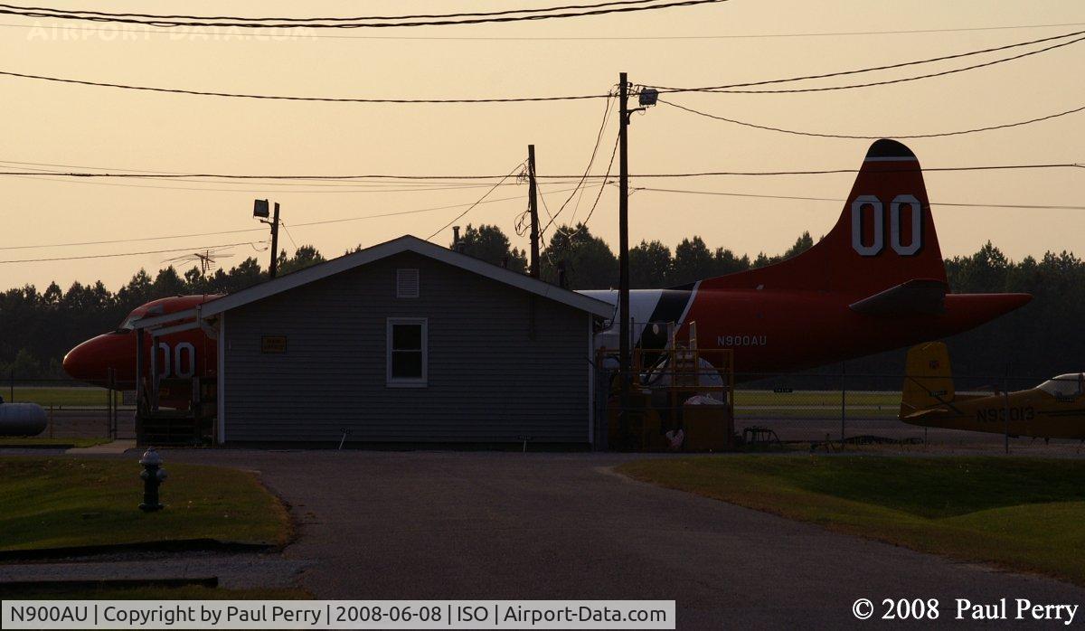 N900AU, 2010 Lockheed P-3A Aerostar C/N 185-5104 (151391), Can't even hide her behind a building
