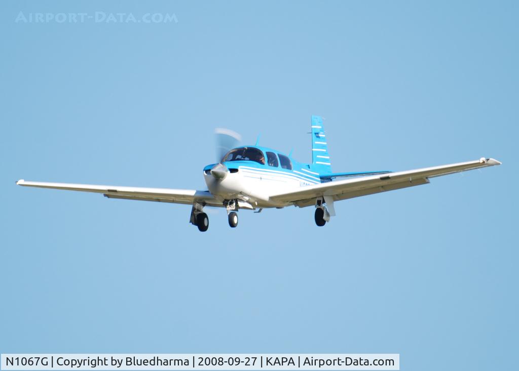 N1067G, 1990 Mooney M20J 201 C/N 24-3174, On final for 17L.